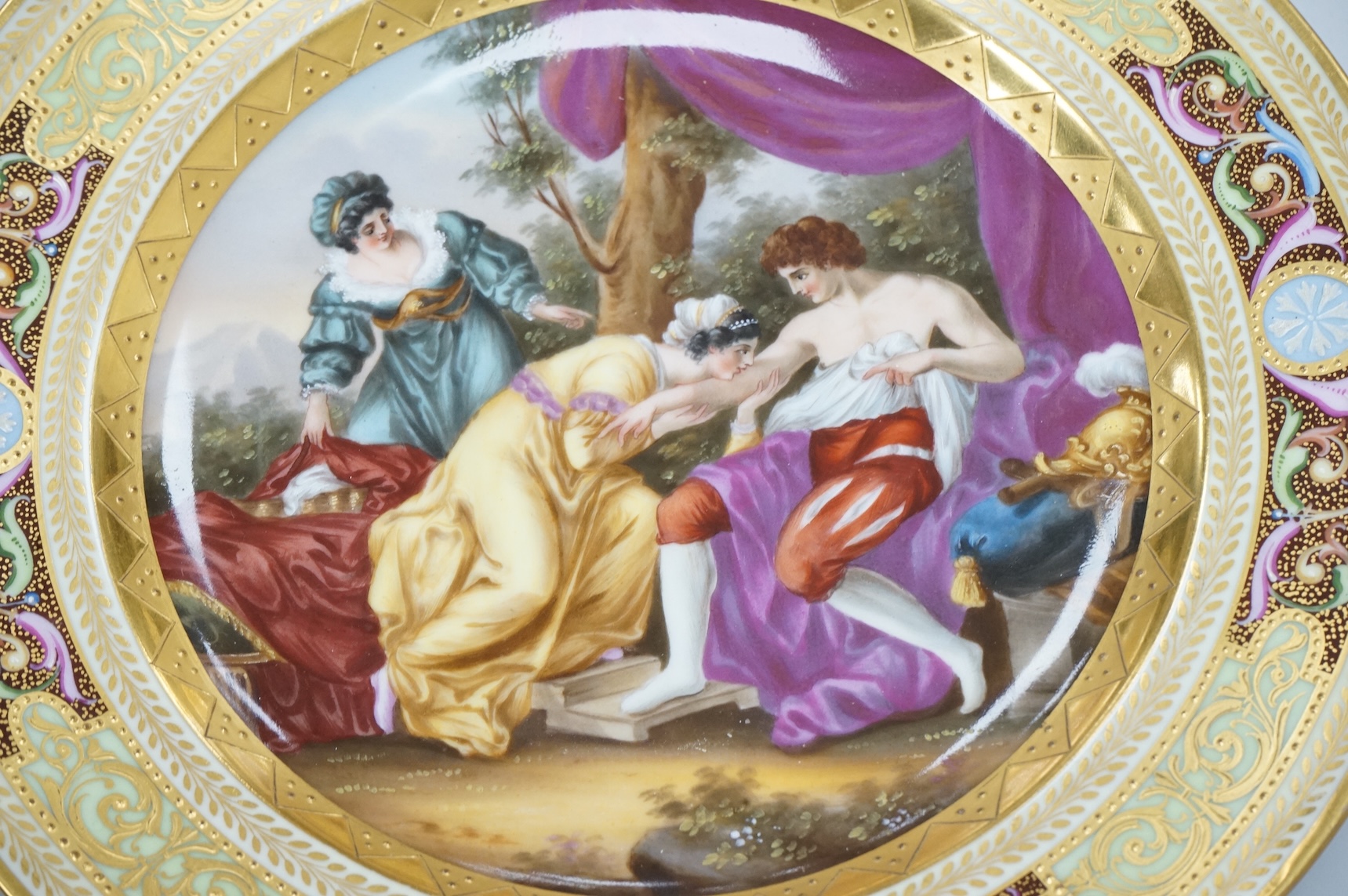 A Vienna style cabinet plate depicting a Prince and courtiers, unsigned, 24cm in diameter
